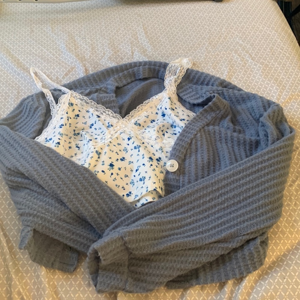 Blue sweater with flower Lacey top underneath